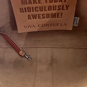 Consuela natural leather tote with leather fringe embellishment.